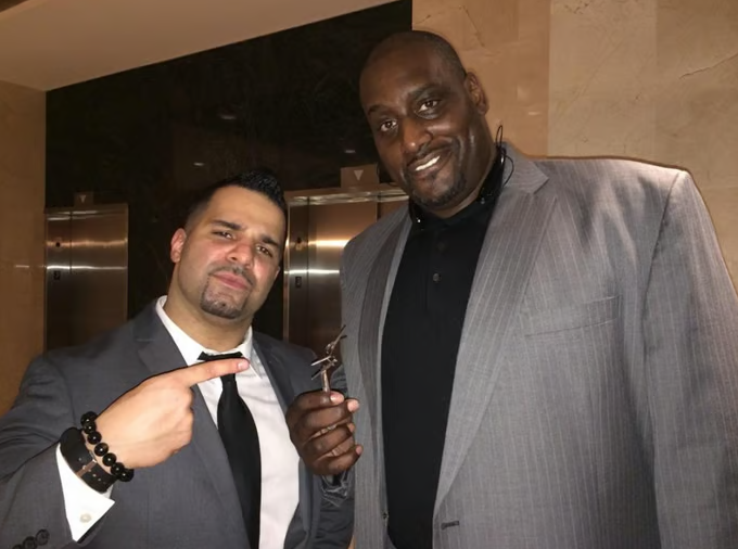 Emran Riaz with former NBA player Anthony Mason